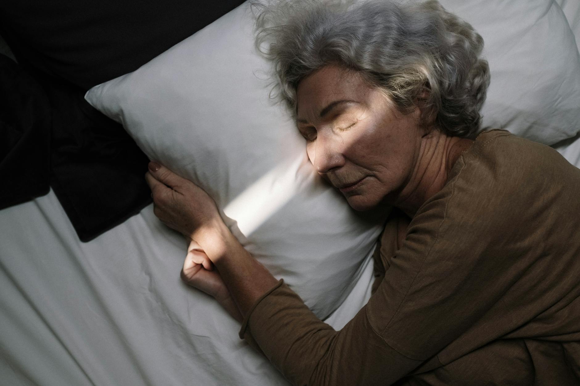 an elderly woman sleeping